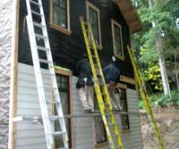 Sean and Eddie working on the siding